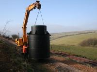 The main treatment plant is carried down the transshipment siding and over the mainline.