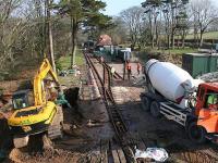 The treatment plant and storage tank are concreted into position.