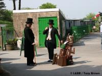 The two gentleman travellers are back, making small talk while waiting for the next train